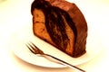 Slice of Marble bundt cake with chocolate glaze Royalty Free Stock Photo