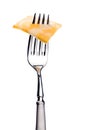 A slice of marbled cheese on a silver fork
