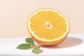 Slice orange fruit with orange leaf on color background Royalty Free Stock Photo