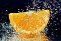 Slice of orange with stopped motion water drops Royalty Free Stock Photo