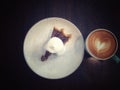 A slice of pecan pie with whipped cream on a white plate and hot coffee ,Traditional Thanksgiving individual serving of pecan pie Royalty Free Stock Photo