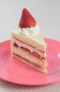 Slice piece of Strawberry shortcake on pink dish Royalty Free Stock Photo