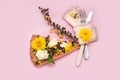 Piece pizza slice yellow pink background plug knife flower dandelion green yellow bouquet bunch tulip