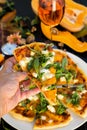 Slice of pizza with pumpkin and feta