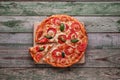 Slice of pizza on wood chopping board. Top view Royalty Free Stock Photo