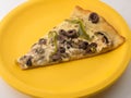 a slice of pizza on a yellow plate Royalty Free Stock Photo