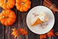 Slice of pumpkin cheesecake, top view on rustic wood