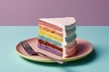 a slice of rainbow cake on a plate with a fork