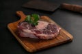 Slice of raw beef shank on a cutting board Royalty Free Stock Photo