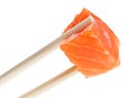 Slice of red salmon fish in chopsticks Royalty Free Stock Photo