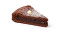 Slice of Rich Chocolate Cake Dusted with Powdered Sugar and Topped with a Single Nut on a White Background Royalty Free Stock Photo