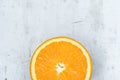 Slice of Ripe Juicy Vibrant Vivid Color Orange on Gray Stone Concrete Metal Background. High Resolution Food Poster. Vitamins