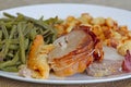 Slice of roast pork orloff and vegetables on a table