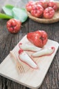 Slice rose apple on wood plate Royalty Free Stock Photo