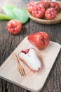 Slice rose apple on wood plate Royalty Free Stock Photo