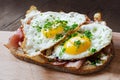 Slice of rustic bread with ham and fried eggs Royalty Free Stock Photo