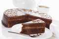 Slice of Sacher cake in plate with coffee Royalty Free Stock Photo