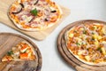 Slice of Seafood Italian Pizza and Hawaiian Chicken BBQ Italian Pizza and Bacon,Garlic and Chilli Italian Pizza on wood dish Royalty Free Stock Photo