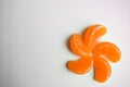 Slice sections of tangerine, mandarin served over the white background