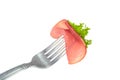 Slice of smoked ham on fork Royalty Free Stock Photo