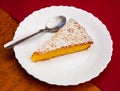 Slice of Spanish almond pie Torta de Santiago