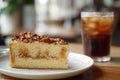 Slice of Spanish Gato de Almendras cake and glass of iced coffee