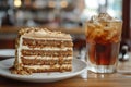 Slice of Spanish Gato de Almendras cake and glass of iced coffee