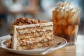 Slice of Spanish Gato de Almendras cake and glass of iced coffee.