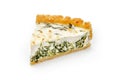 Slice of spinach & feta cheese pie isolated on white