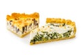 Slice of spinach & feta cheese pie on white