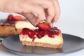 Slice of Strawberry cheese cake. Silky smooth and creamy cheese cake topped with homemade fresh strawberry sauce Royalty Free Stock Photo