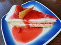 A slice of strawberry shortcake with red syrup Royalty Free Stock Photo