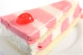 A slice of strawberry and vanilla mousse cake