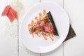 Slice of sushi pizza with tuna, tobiko and wakame Royalty Free Stock Photo