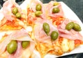 Slice of takeaway pizza meal with tomato mozzarella cheese ham Royalty Free Stock Photo
