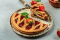 Slice of tart strawberry jam, italian pie crostata on a wooden board. place for text, top view Royalty Free Stock Photo