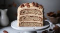 Slice of Three Layer Maple Cake with Maple Frosting and Candied Pecans on White Plate Royalty Free Stock Photo