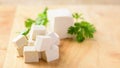 Slice tofu on wooden board preparing for cooking