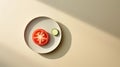 A slice of tomato and cucumber on a plate, top view, empty light space