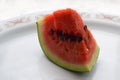 A slice of watermelon on a plate close-up Royalty Free Stock Photo