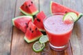 slice of watermelon for smoothies with lime on wood Royalty Free Stock Photo