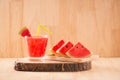 Slice of watermelon for smoothies with lime on woods background Royalty Free Stock Photo