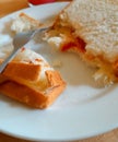 a slice of white bread with strawberry jam and pineapple enjoyed with a fork Royalty Free Stock Photo