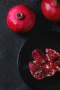 Slice and whole pomegranates