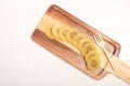 Slice of yellow kiwigold kiwi on plate. Royalty Free Stock Photo