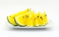 Slice yellow watermelon on dish isolated