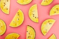 Slice of Yellow watermelon on a pink background. Bright summer background Royalty Free Stock Photo