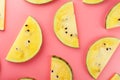 Slice of Yellow watermelon on a pink background. Bright summer background Royalty Free Stock Photo