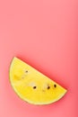 Slice of Yellow watermelon on a pink background. Bright summer background Royalty Free Stock Photo