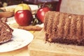 Sliced apple cinnamon bread. with decorations on wooden table. Made from apples, sugar, oil, eggs, flour. Homemade apple loaf cake Royalty Free Stock Photo